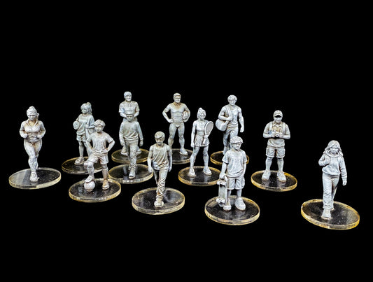 Front view of 12 unpainted 28mm Western civilian miniatures featuring athletes and children